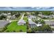 Residential neighborhood featuring mature trees and manicured lawns surrounding well-maintained homes at 23493 Taber Ave, Port Charlotte, FL 33954