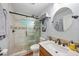 Bathroom features a walk-in shower with pebble floor, upgraded fixtures, and a single sink vanity at 23493 Taber Ave, Port Charlotte, FL 33954