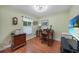 Office space with built-in desk, wood floors, and natural light, perfect for a home office or study at 23493 Taber Ave, Port Charlotte, FL 33954