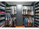 Custom walk-in closet with built-in shelving and storage for clothes, shoes, and accessories at 23493 Taber Ave, Port Charlotte, FL 33954