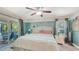 Bedroom with ceiling fan, access to covered patio, and coastal decor accents at 237 Strasburg Dr, Port Charlotte, FL 33954