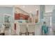 Stylish kitchen featuring stainless steel appliances, counter seating, and open layout to living area at 237 Strasburg Dr, Port Charlotte, FL 33954