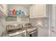 Efficient laundry room with modern appliances, ample storage space and thoughtful organization solutions at 237 Strasburg Dr, Port Charlotte, FL 33954