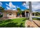 Beautifully landscaped front yard with a well-maintained lawn and a charming home exterior at 2387 Nuremberg Blvd, Punta Gorda, FL 33983