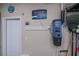Garage showcasing central vacuum system, tools and a door at 2387 Nuremberg Blvd, Punta Gorda, FL 33983