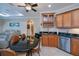 Open kitchen with a breakfast bar, stainless steel appliances and seamless connection to the living area at 2387 Nuremberg Blvd, Punta Gorda, FL 33983