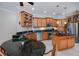 Well-equipped kitchen with stainless steel appliances, wooden cabinets, and a granite-topped island at 2387 Nuremberg Blvd, Punta Gorda, FL 33983