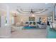 Elegant living room with tray ceilings, a chandelier, and comfortable seating arrangement at 2387 Nuremberg Blvd, Punta Gorda, FL 33983