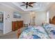 Spacious main bedroom showcasing a dresser and a view to the adjoining hallway and en-suite bathroom at 2387 Nuremberg Blvd, Punta Gorda, FL 33983