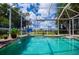 Screened in pool and spa with lush landscaping at 2387 Nuremberg Blvd, Punta Gorda, FL 33983