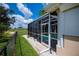 Screened pool enclosure with clear views of manicured lawn and blue skies at 2387 Nuremberg Blvd, Punta Gorda, FL 33983