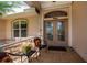 Cozy front porch with seating, a decorative front door, and tiled flooring at 2387 Nuremberg Blvd, Punta Gorda, FL 33983