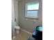 Cozy bathroom with vessel sink, toilet, and a window providing natural light at 26129 Madras Ct, Punta Gorda, FL 33983