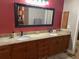 Spacious bathroom featuring double sinks, granite countertops, and modern fixtures, enhancing its appeal at 26129 Madras Ct, Punta Gorda, FL 33983
