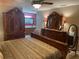 Elegant bedroom showcasing a grand bed, stylish furnishings, and a glimpse into the en-suite bathroom at 26129 Madras Ct, Punta Gorda, FL 33983