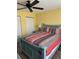 Comfortable bedroom featuring a blue-painted wooden bed frame and colorful bedding at 26129 Madras Ct, Punta Gorda, FL 33983