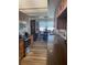 Stylish kitchen with stainless steel appliances, wooden cabinets, and a view towards the dining area at 26129 Madras Ct, Punta Gorda, FL 33983