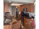 Modern kitchen featuring stainless steel appliances, wood cabinets, and a double basin sink at 26129 Madras Ct, Punta Gorda, FL 33983