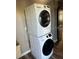 Stacked laundry unit, washer and dryer, providing a convenient laundry solution at 26129 Madras Ct, Punta Gorda, FL 33983
