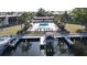 Aerial view of complex showcasing the waterfront, pool, and boat lift at 311 Garvin St # 405B, Punta Gorda, FL 33950