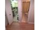View into the tiled bathroom and adjacent laundry area, accessible from the hallway at 311 Garvin St # 405B, Punta Gorda, FL 33950