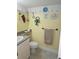 Fun bathroom featuring decor of marine animals, sink, toilet, and towel rack at 311 Garvin St # 405B, Punta Gorda, FL 33950