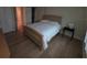 Bedroom featuring wood floors, a large bed, and windows that allow ample light at 311 Garvin St # 405B, Punta Gorda, FL 33950