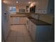 Updated kitchen with modern appliances and clean, white cabinets at 311 Garvin St # 405B, Punta Gorda, FL 33950
