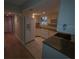 Well-lit kitchen showcasing white cabinetry, tile floors, and modern appliances at 311 Garvin St # 405B, Punta Gorda, FL 33950