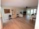 Spacious living room with wood flooring, ceiling fan, and sliding glass doors at 311 Garvin St # 405B, Punta Gorda, FL 33950