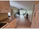 Open floor plan: living room view from kitchen showcasing wood flooring and comfortable seating at 311 Garvin St # 405B, Punta Gorda, FL 33950