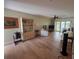 Bright living room featuring wood flooring, ceiling fan, and comfortable seating at 311 Garvin St # 405B, Punta Gorda, FL 33950