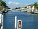 Picturesque waterfront view showcases a canal with docks and lush landscaping at 311 Garvin St # 405B, Punta Gorda, FL 33950