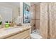 Stylish bathroom featuring modern fixtures, granite countertop, and tiled shower at 3138 Darius Ave, North Port, FL 34288