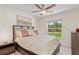 Well-lit bedroom with a comfortable bed and a view of the outdoors at 3138 Darius Ave, North Port, FL 34288