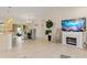 Open-concept dining area with modern lighting, an electric fireplace, and patio access at 3138 Darius Ave, North Port, FL 34288