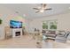 Comfortable living room with an electric fireplace, neutral-toned furniture, and natural light at 3138 Darius Ave, North Port, FL 34288