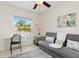 Home office with a desk, sofa, and natural light from the window at 3138 Darius Ave, North Port, FL 34288