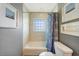 Bright bathroom features a tiled tub and shower and neutral wall paint at 3171 Highlands Rd, Punta Gorda, FL 33983