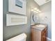 Neat bathroom features sleek vanity, mirror with decorative lighting, and neutral wall paint at 3171 Highlands Rd, Punta Gorda, FL 33983