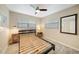 Modern bedroom showcases two windows, a ceiling fan, and a striking headboard at 3171 Highlands Rd, Punta Gorda, FL 33983