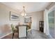 Cozy dining area features modern lighting, a round table, and views of the kitchen at 3171 Highlands Rd, Punta Gorda, FL 33983
