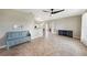 Spacious living room with tile floors, neutral walls, and access to kitchen and dining areas at 3171 Highlands Rd, Punta Gorda, FL 33983