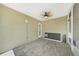 Sunroom with tile flooring, fan, and a door that leads to the outside at 3171 Highlands Rd, Punta Gorda, FL 33983