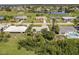 Beautiful aerial shot of waterfront homes situated near a golf course and featuring a serene pond at 37 Oakland Hills Ct, Rotonda West, FL 33947
