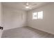 Bright bedroom with a large window, light wood floors, and neutral walls at 37 Oakland Hills Ct, Rotonda West, FL 33947