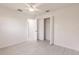 Light and airy bedroom featuring light wood floors, closet, and modern ceiling fan at 37 Oakland Hills Ct, Rotonda West, FL 33947