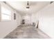 Clean garage features concrete floors, white walls, and ample space for parking and storage at 37 Oakland Hills Ct, Rotonda West, FL 33947