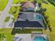Home aerial view displays the pool and roof at 411 Scarlet Sage, Punta Gorda, FL 33955