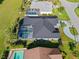 Aerial view of home showing roof and screened pool at 411 Scarlet Sage, Punta Gorda, FL 33955